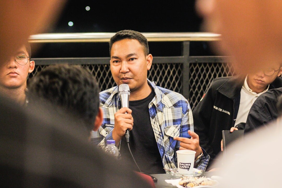 Person practicing public speaking in front of group